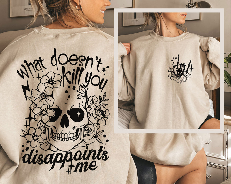 a woman wearing a sweatshirt that says what doesn't kill you