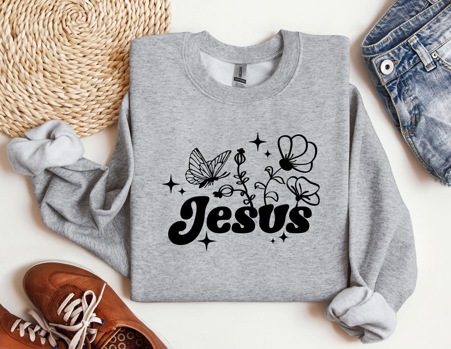 a sweatshirt with the word jesus printed on it