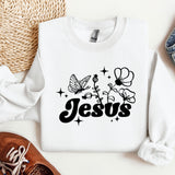a white sweatshirt with the word jesus printed on it