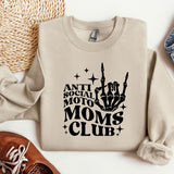 a sweatshirt with the words moms club on it next to a pair of shoes