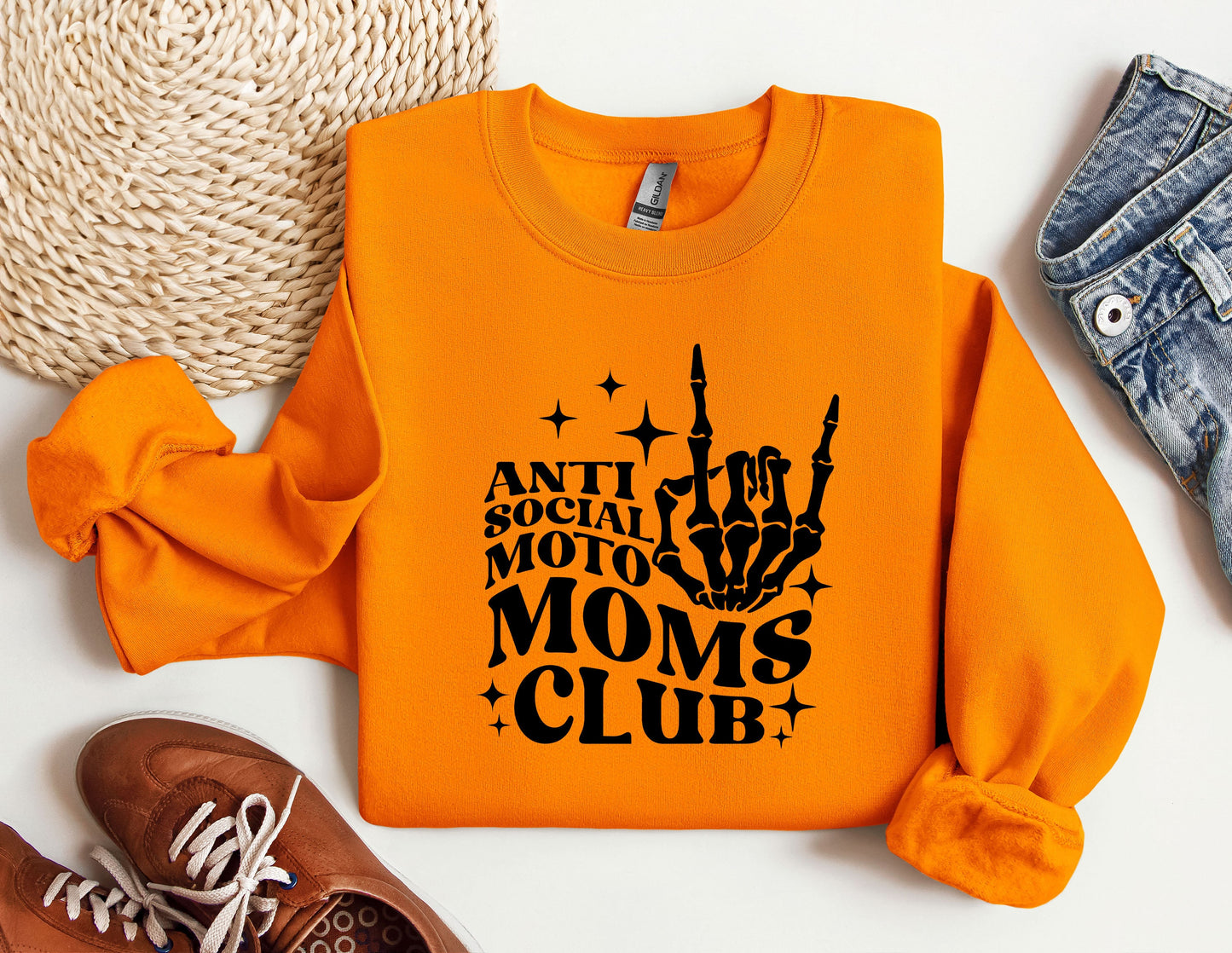 an orange sweatshirt with a black print on it