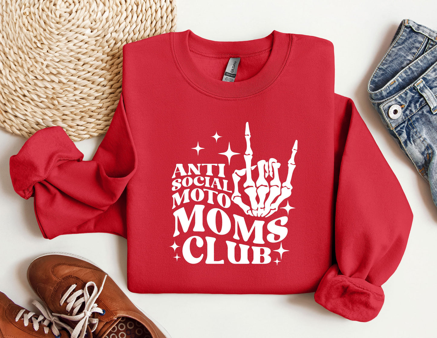 a red sweatshirt that says anti social moto moms club