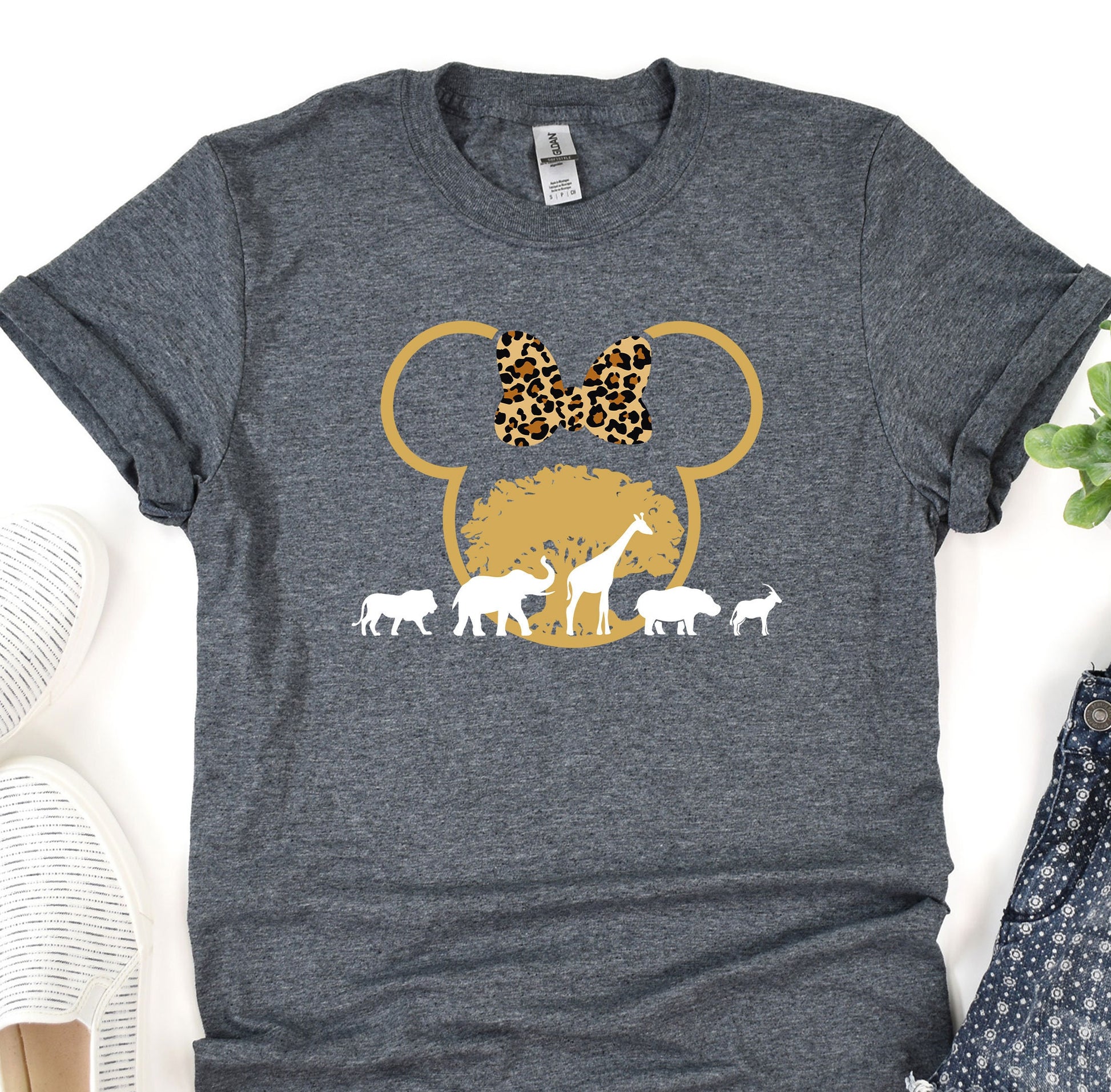 a t - shirt with a mouse and giraffes on it