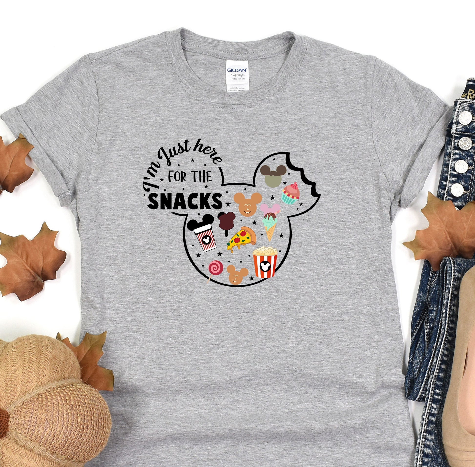 a gray shirt with mickey mouse for the snacks on it