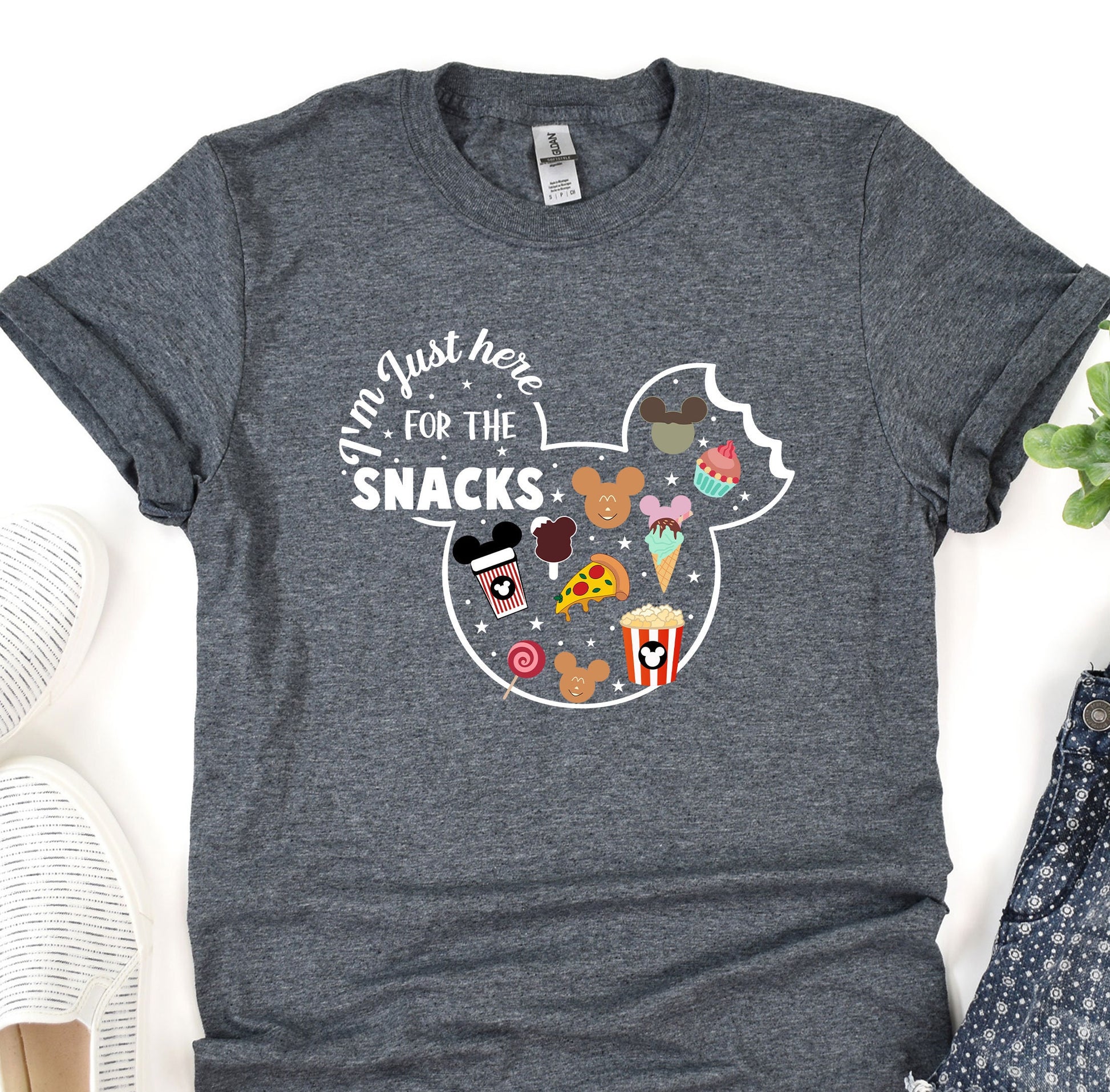 a mickey mouse shirt with some snacks on it