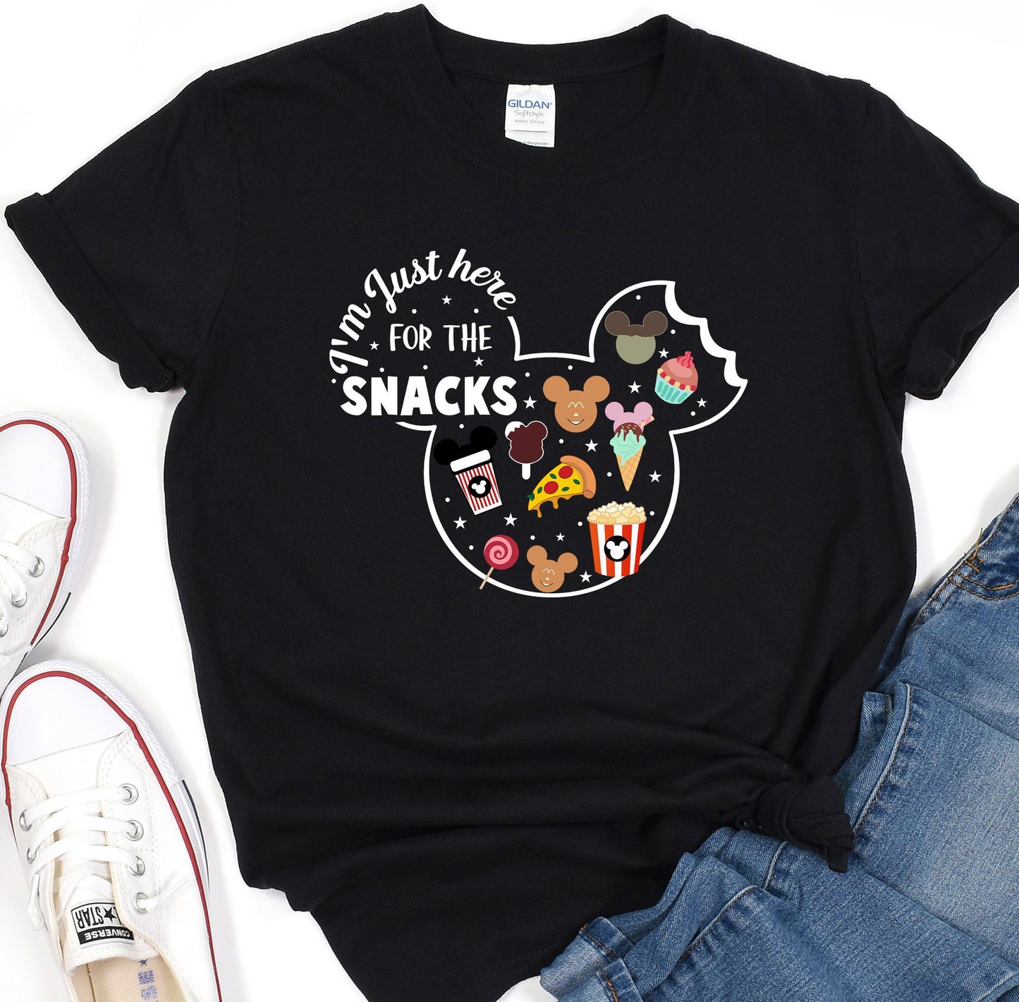 a mickey mouse shirt with some snacks on it