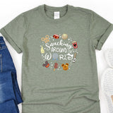 a t - shirt with a bunch of cartoon characters on it