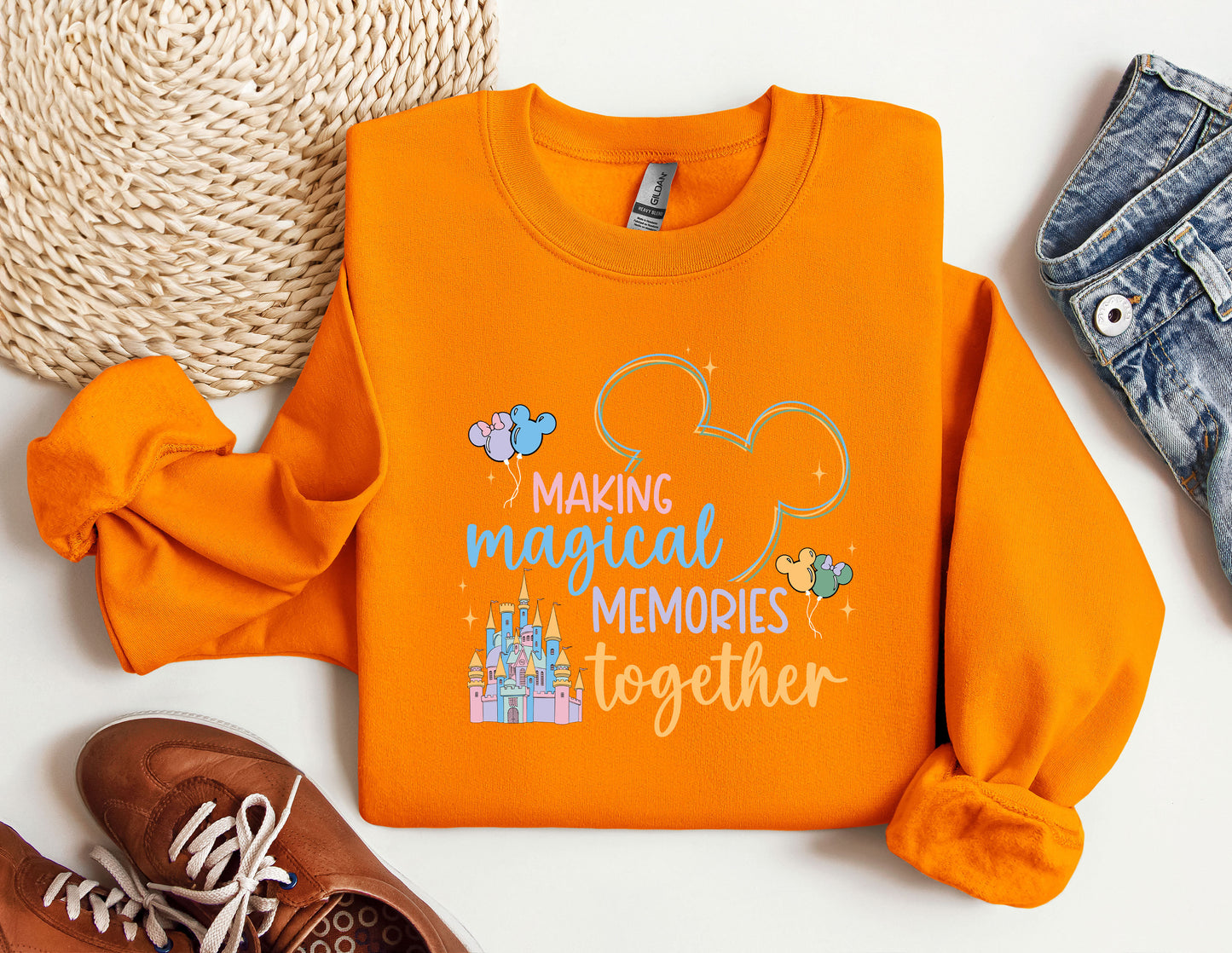 a pair of shoes and an orange shirt with the words making magical memories together