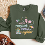 a green sweatshirt with a minnie mouse design on it