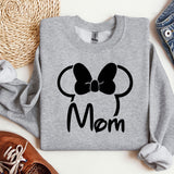 a gray sweatshirt with a black bow on it