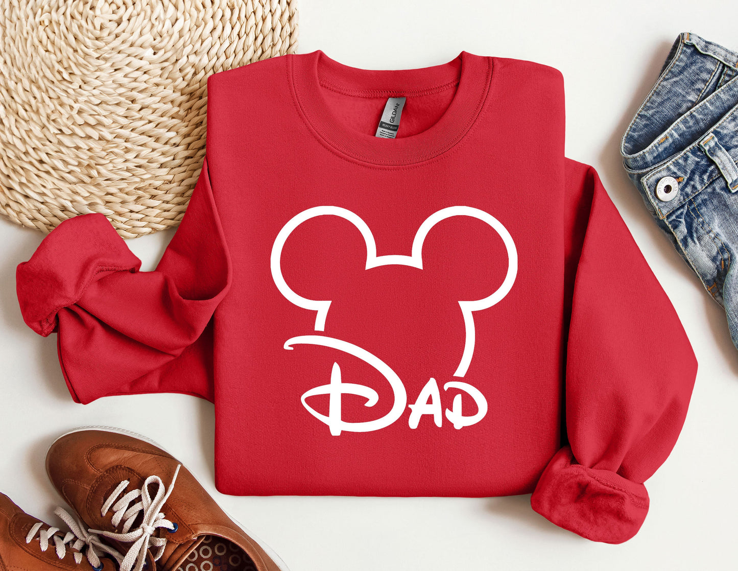 a red sweatshirt with a mickey mouse face on it