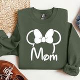a green sweatshirt with a minnie mouse head on it