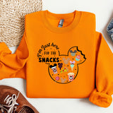 a pair of shoes and an orange mickey mouse shirt