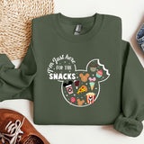 a green sweatshirt with a mickey mouse design