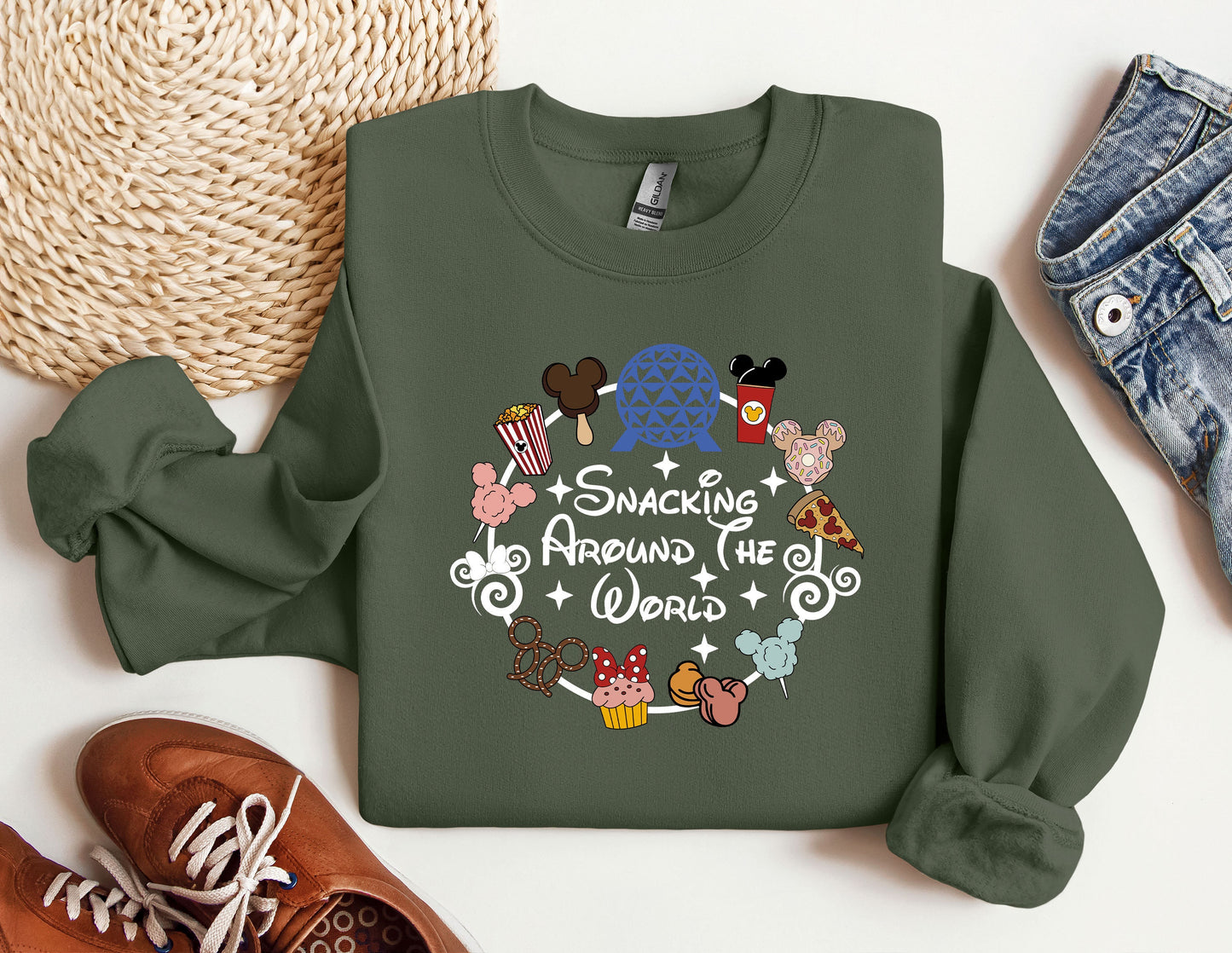 a green sweatshirt with a mickey mouse design on it