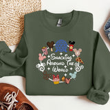 a green sweatshirt with a mickey mouse design on it