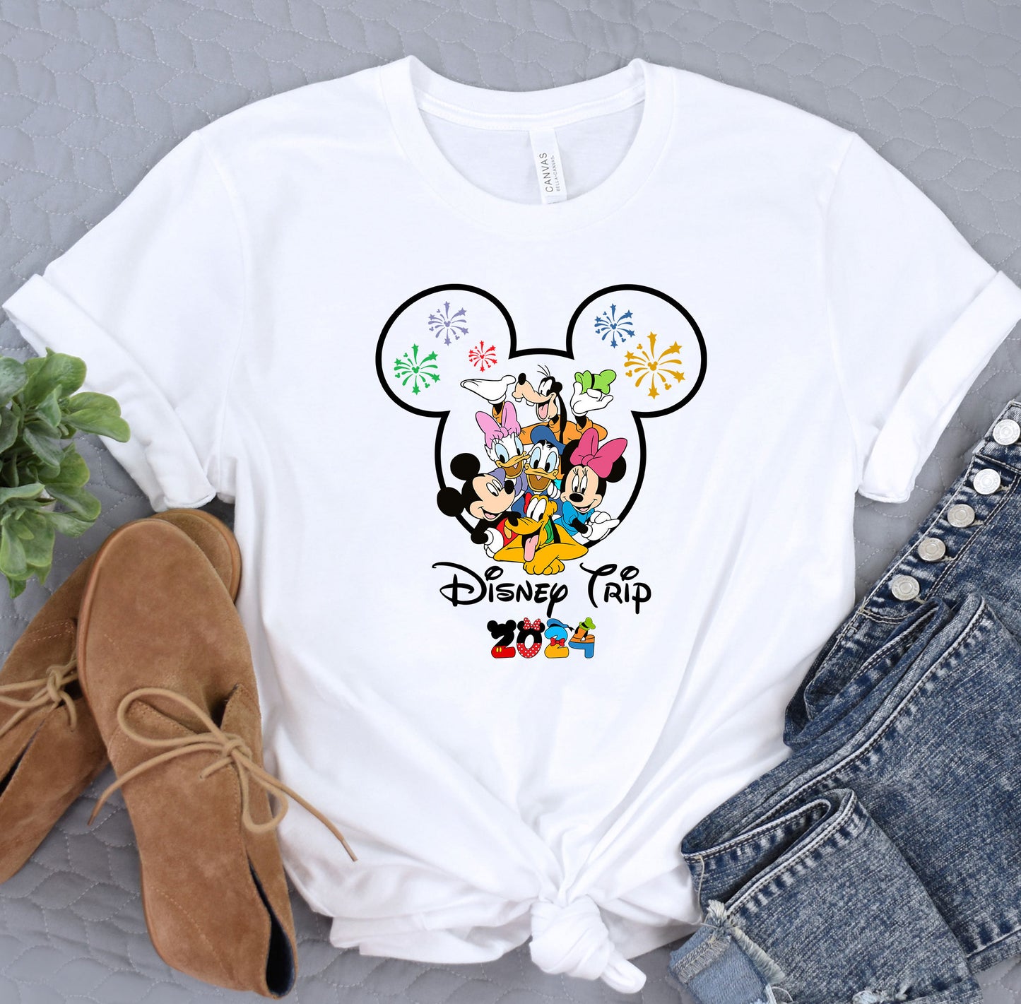 a white shirt with mickey mouse on it