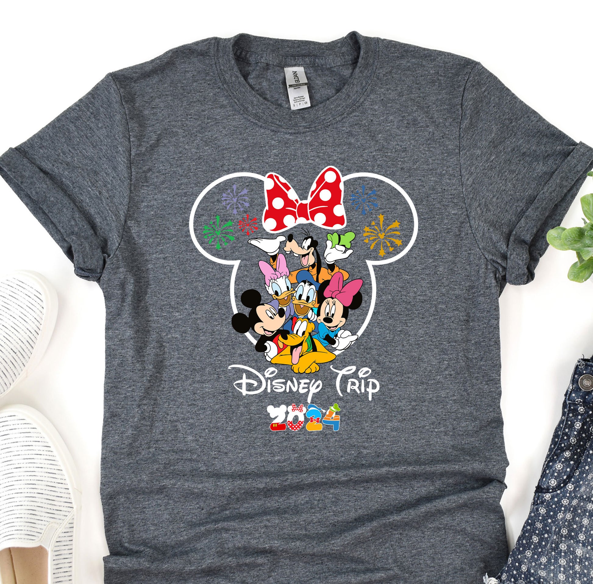 a mickey mouse t - shirt sitting on top of a table