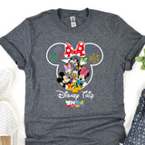 a mickey mouse t - shirt sitting on top of a table