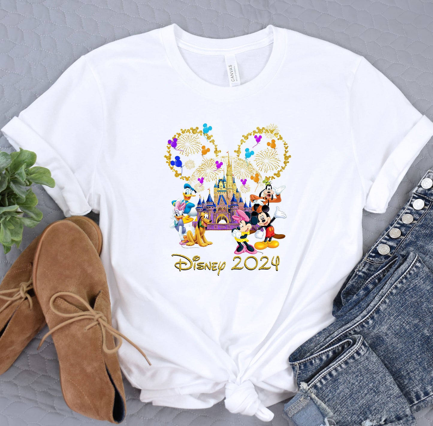 a white shirt with mickey and minnie mouse on it