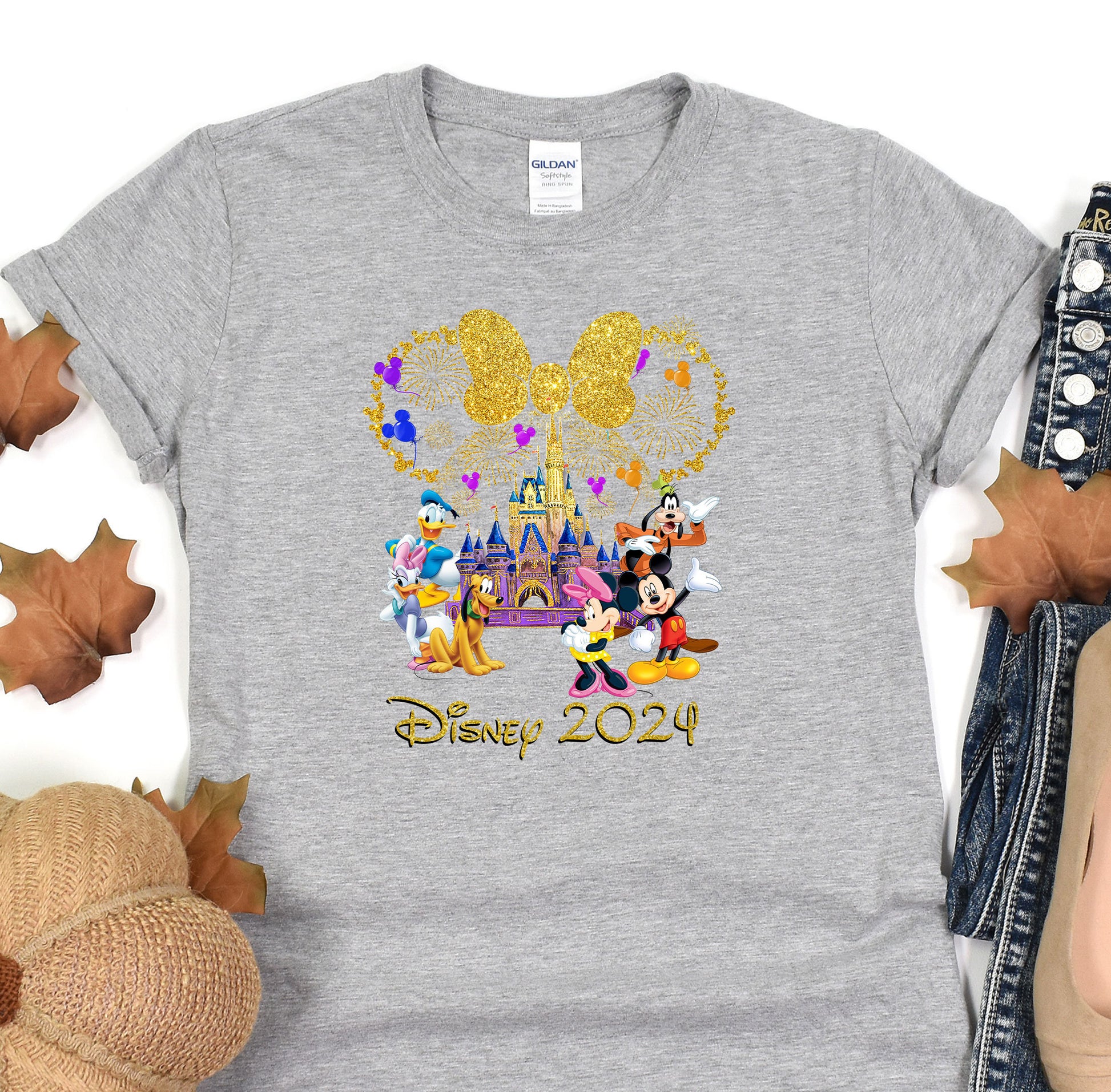 a gray shirt with mickey mouse and friends on it