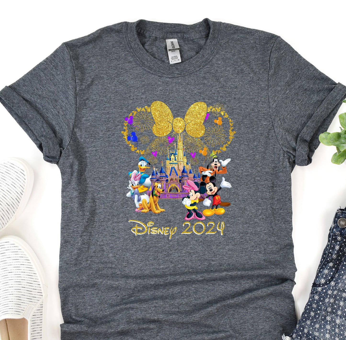 a gray shirt with mickey mouse and friends on it