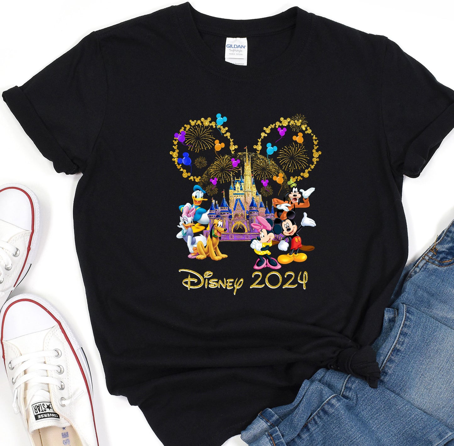 a black shirt with mickey mouse and friends on it