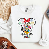 a mickey mouse shirt with a red bow on it