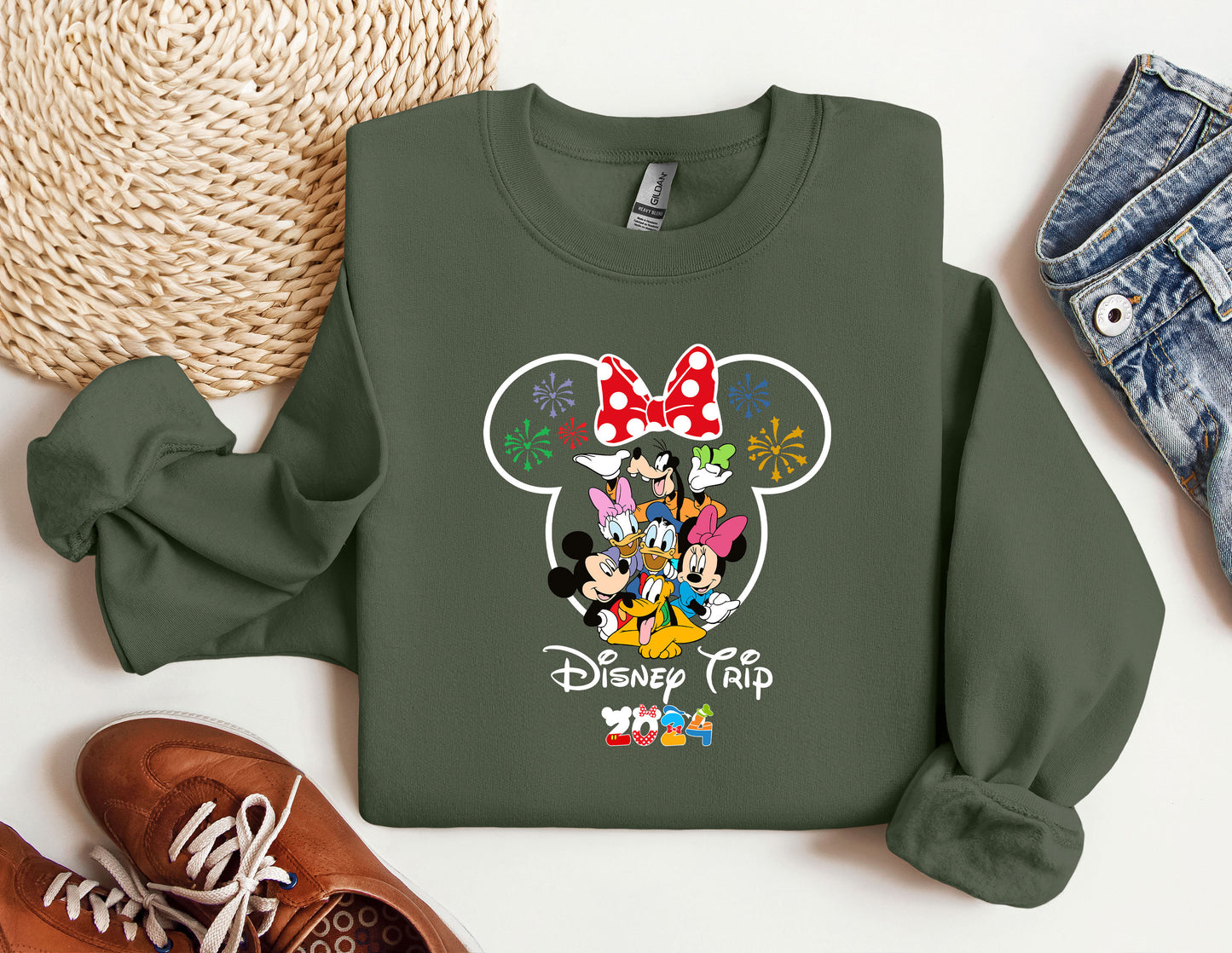 a green sweatshirt with mickey mouse on it