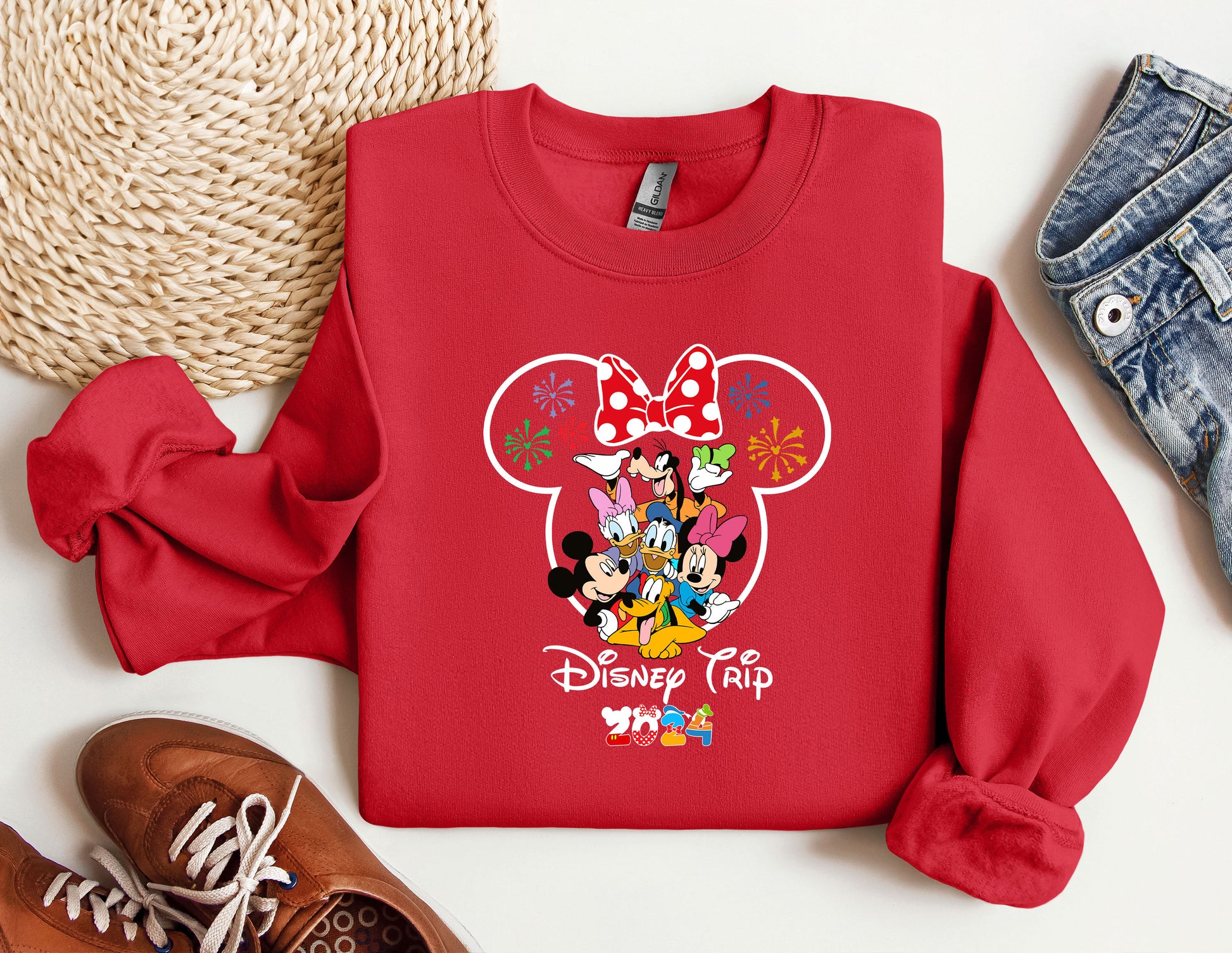 a red sweatshirt with mickey mouse on it