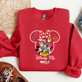 a red sweatshirt with mickey mouse on it