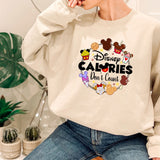 a woman sitting on a chair wearing a sweatshirt that says disney calories don '