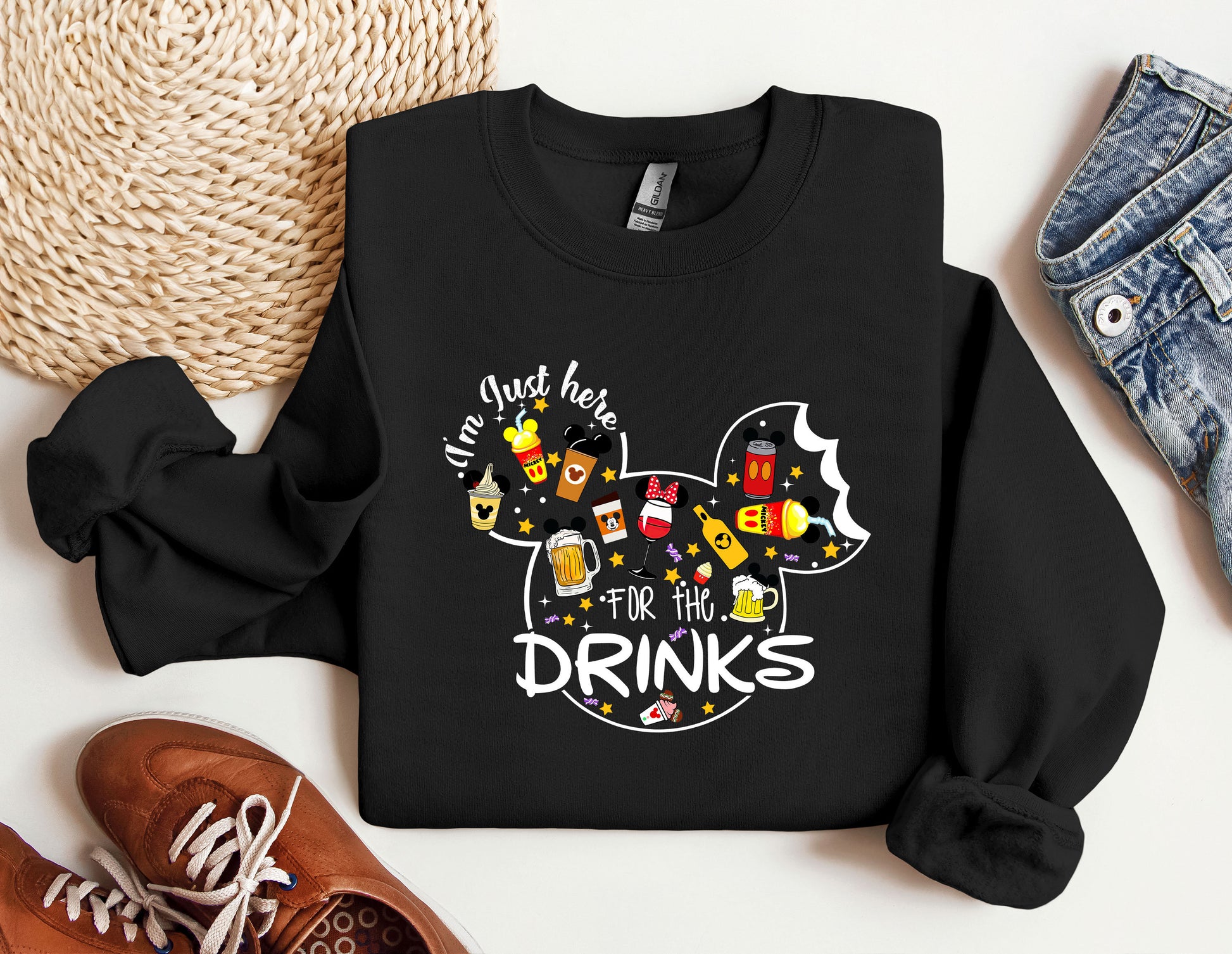 a mickey mouse shirt with the words drink here for the drinks on it