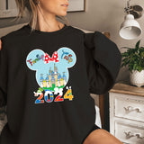 a woman wearing a black mickey mouse shirt