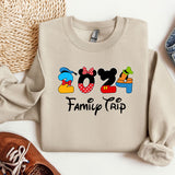 a mickey mouse shirt with a pair of shoes next to it