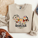 a mickey mouse shirt with the words i'm just here for the snacks