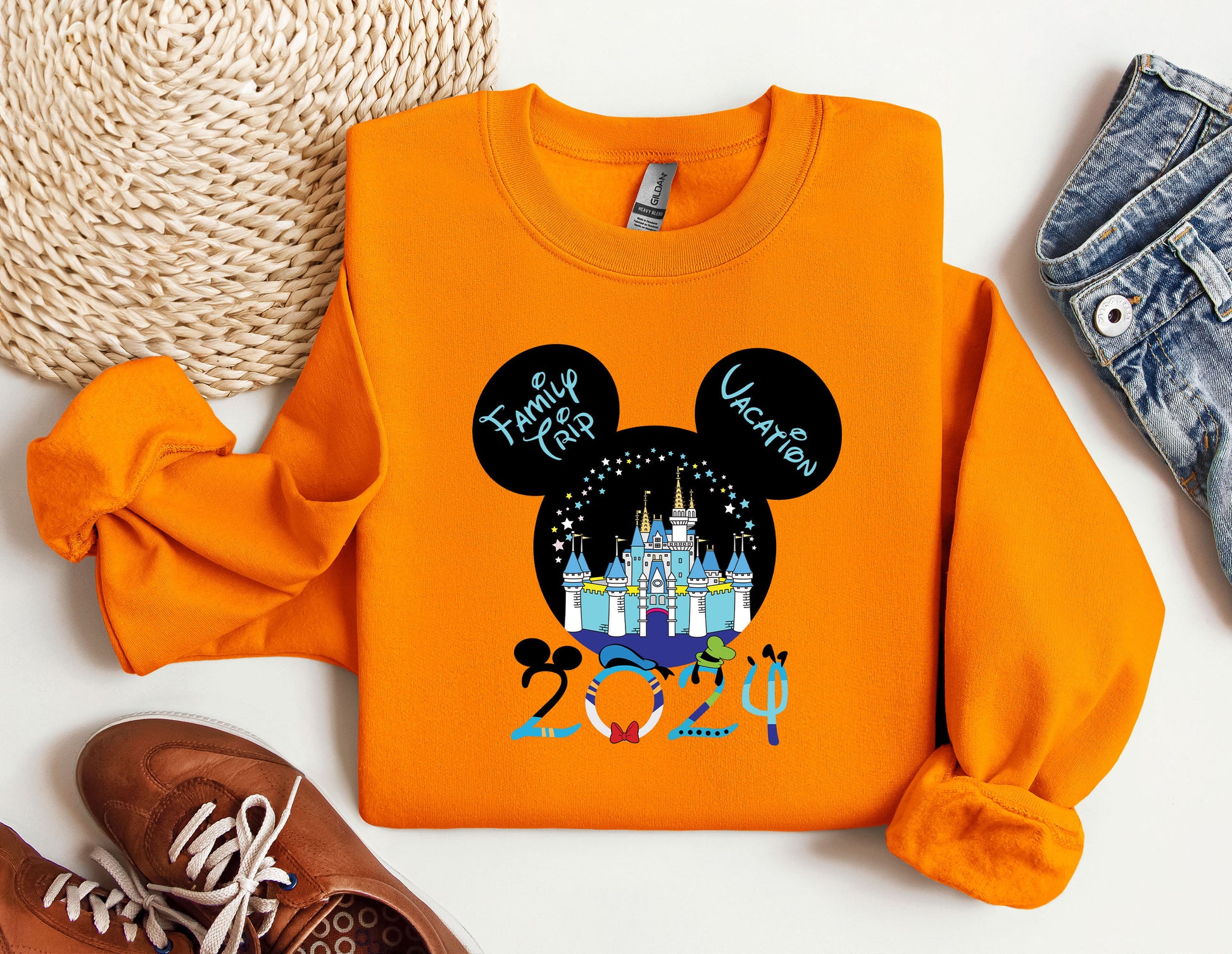 an orange shirt with a mickey mouse on it
