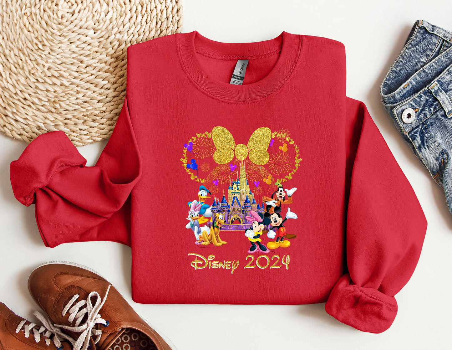 a red sweatshirt with mickey mouse and friends on it