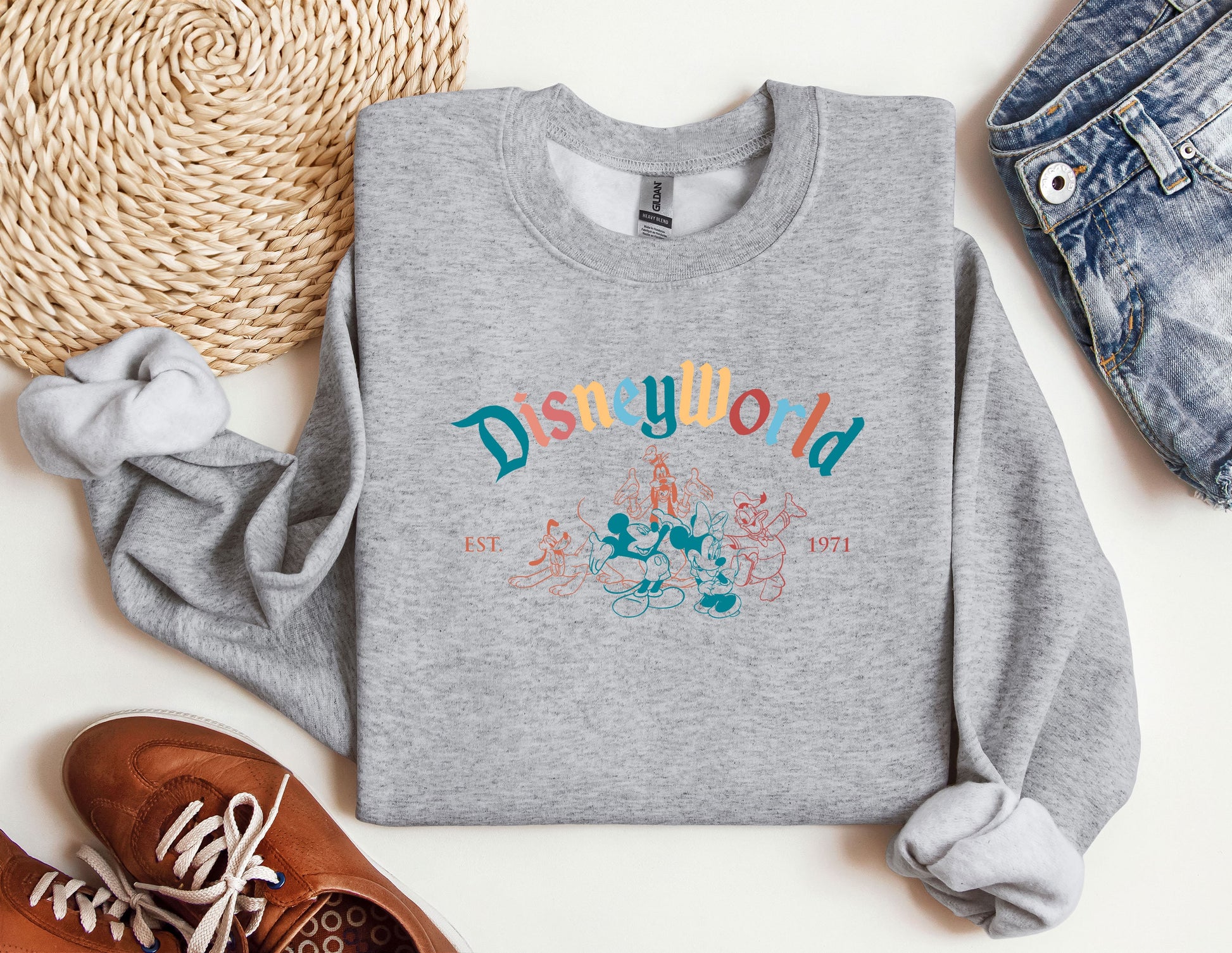 a sweatshirt with the word disneyland printed on it