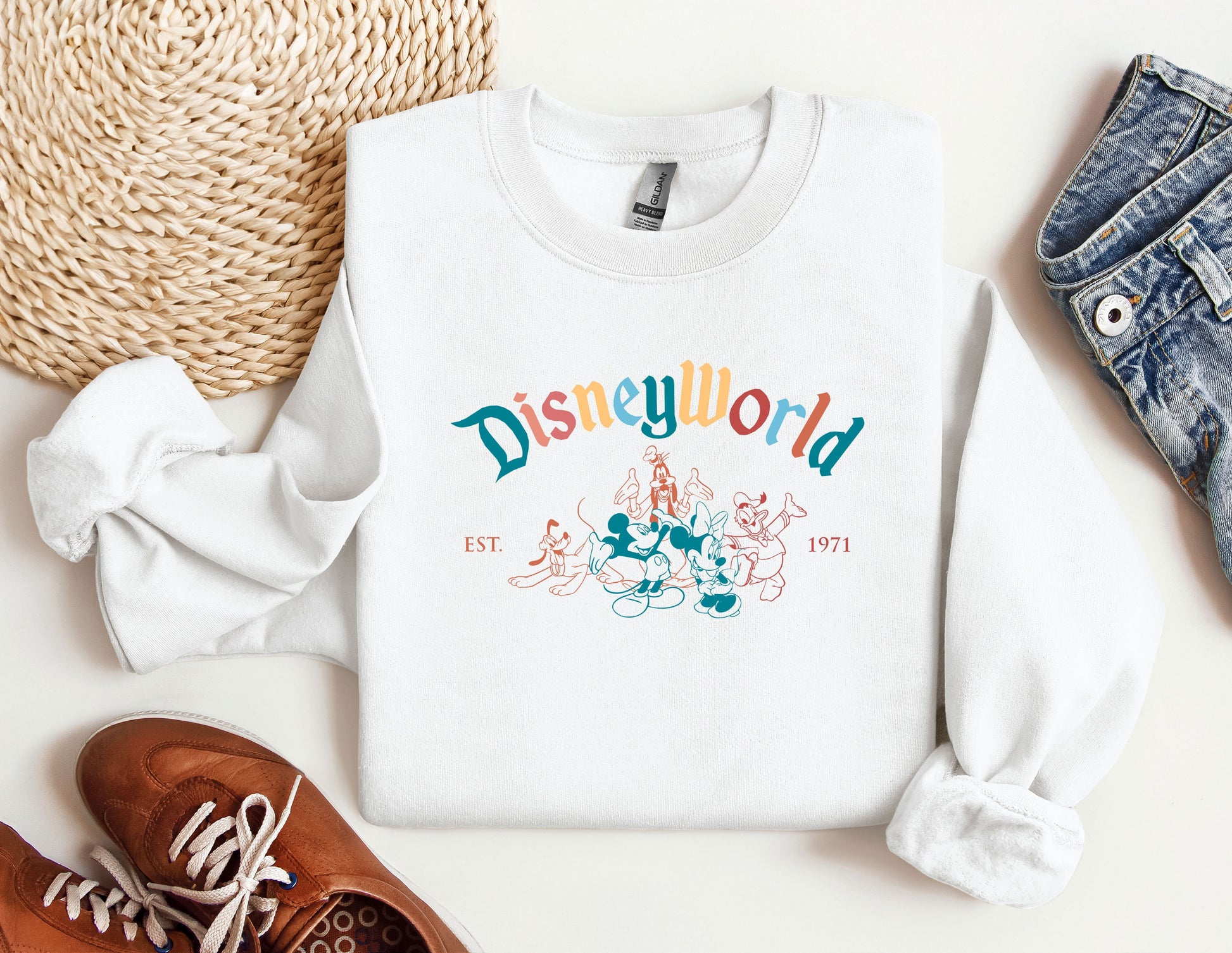 a white sweatshirt with the word disneyland printed on it