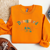 a pair of shoes and a sweatshirt on a white surface