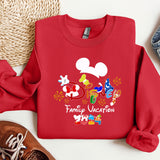 a mickey mouse family vacation shirt next to a pair of sneakers