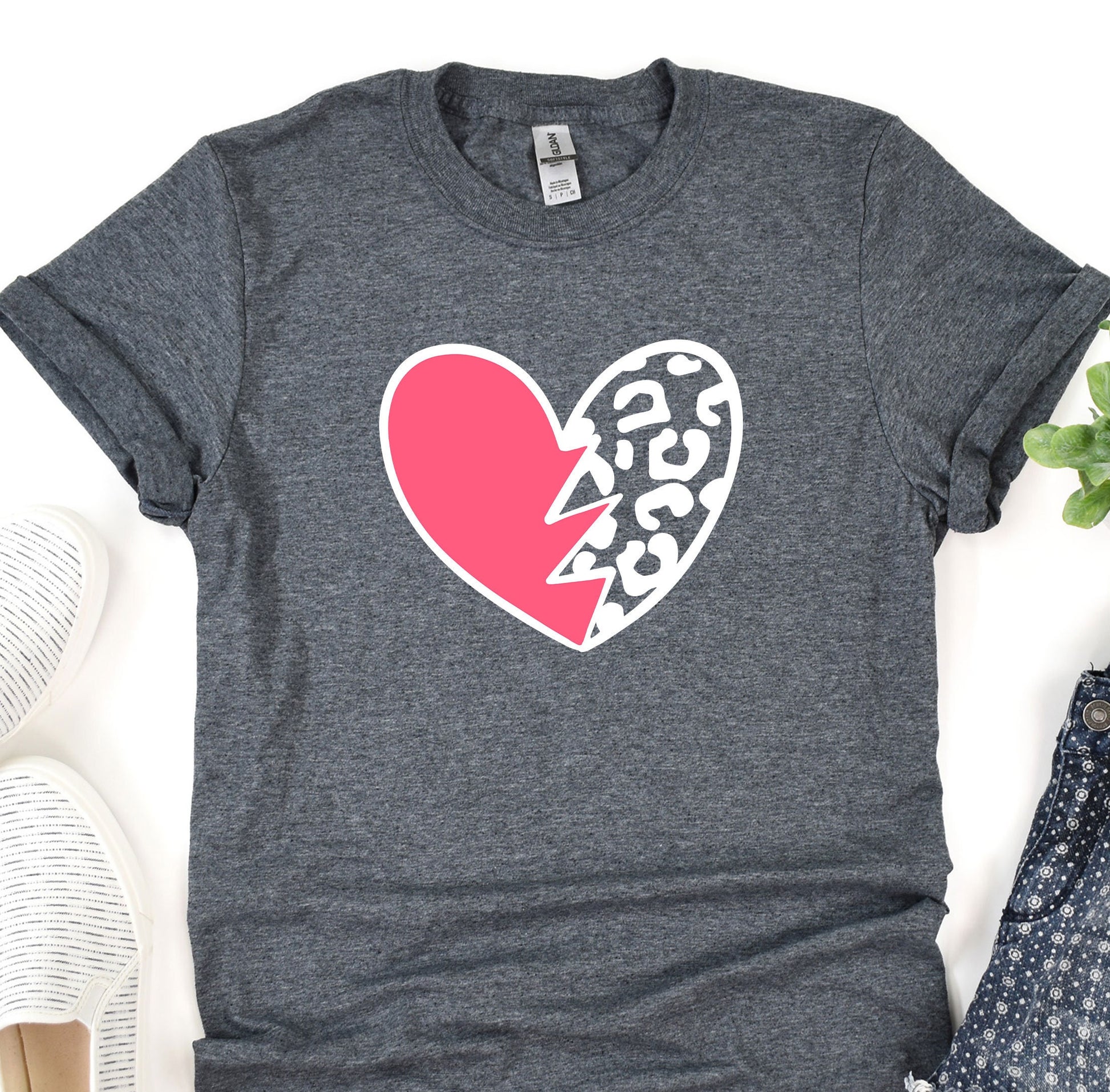 a t - shirt with a heart and a lightning bolt on it