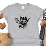 a t - shirt with a hand drawn on it