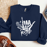 a blue sweatshirt with white graffiti on it