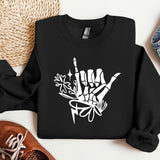 a black sweatshirt with white graffiti on it