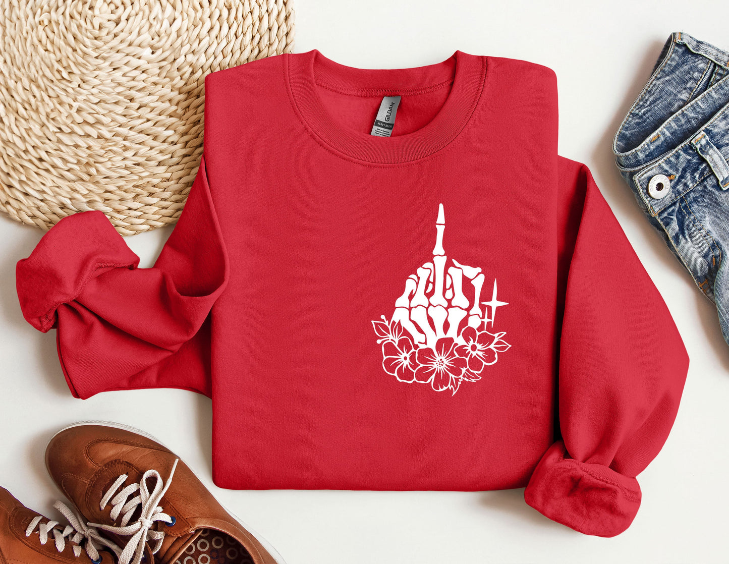 a red sweatshirt with a picture of a church on it