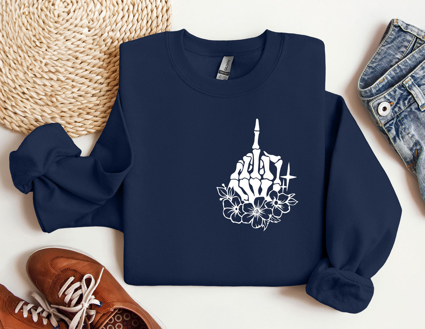 a blue sweatshirt with a picture of a building and flowers on it