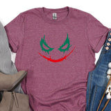 a t - shirt with a joker face painted on it