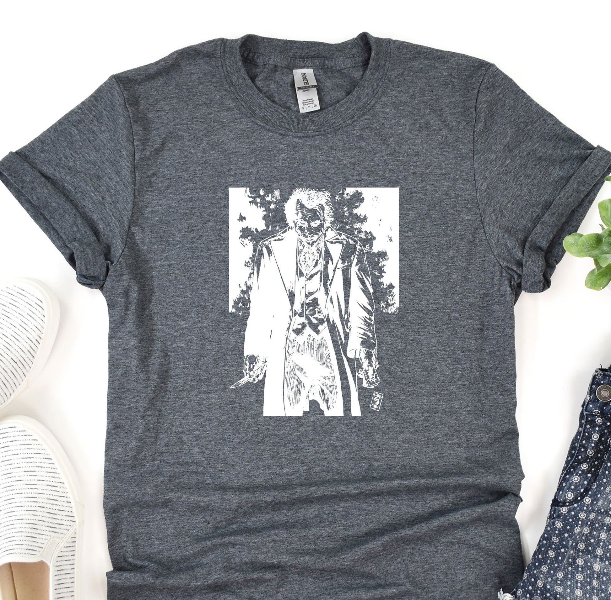 a t - shirt with a picture of a zombie holding a knife